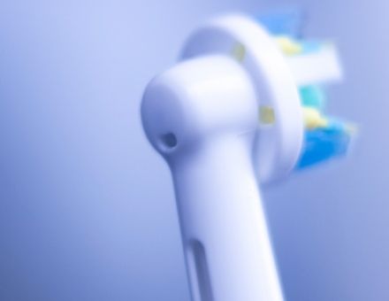 Electric toothbrush head for info on sonic vibration and loose dental crowns